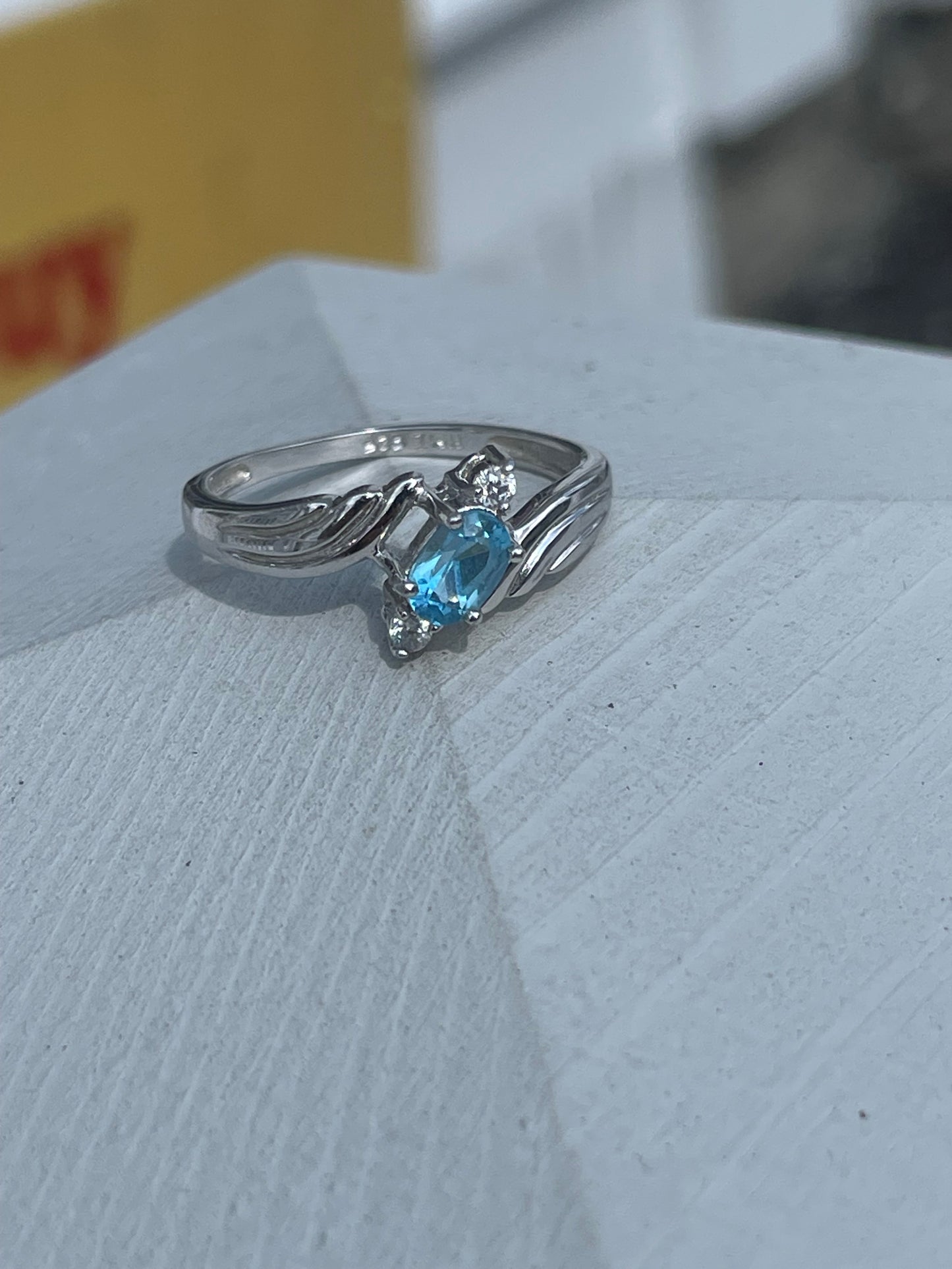 925 Sterling Silver Bypass Oval Blue Topaz & Clear Zirconia Ring
