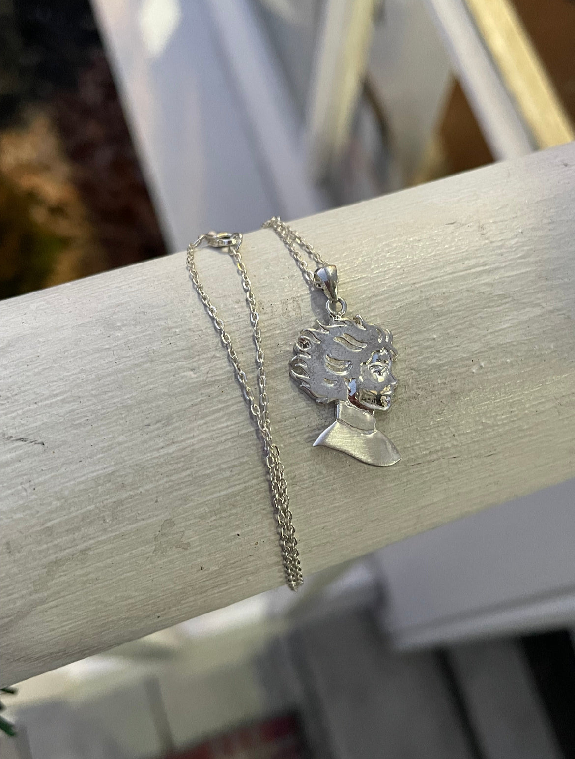 Kristin Kreuk Mad Woman’s Library Logo Necklace