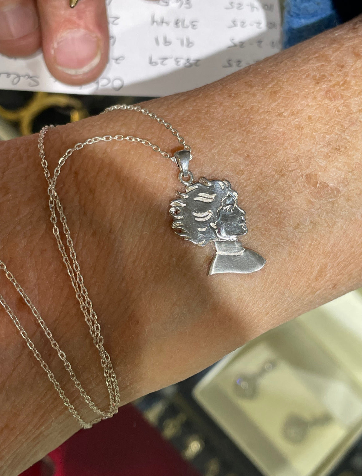 Kristin Kreuk Mad Woman’s Library Logo Necklace