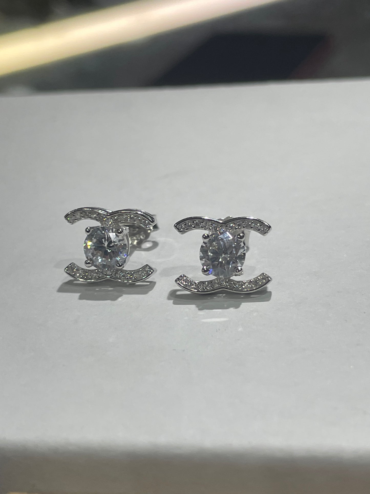 925 Sterling Silver Sparkling Petite Chanel Logo CC Stud Earrings