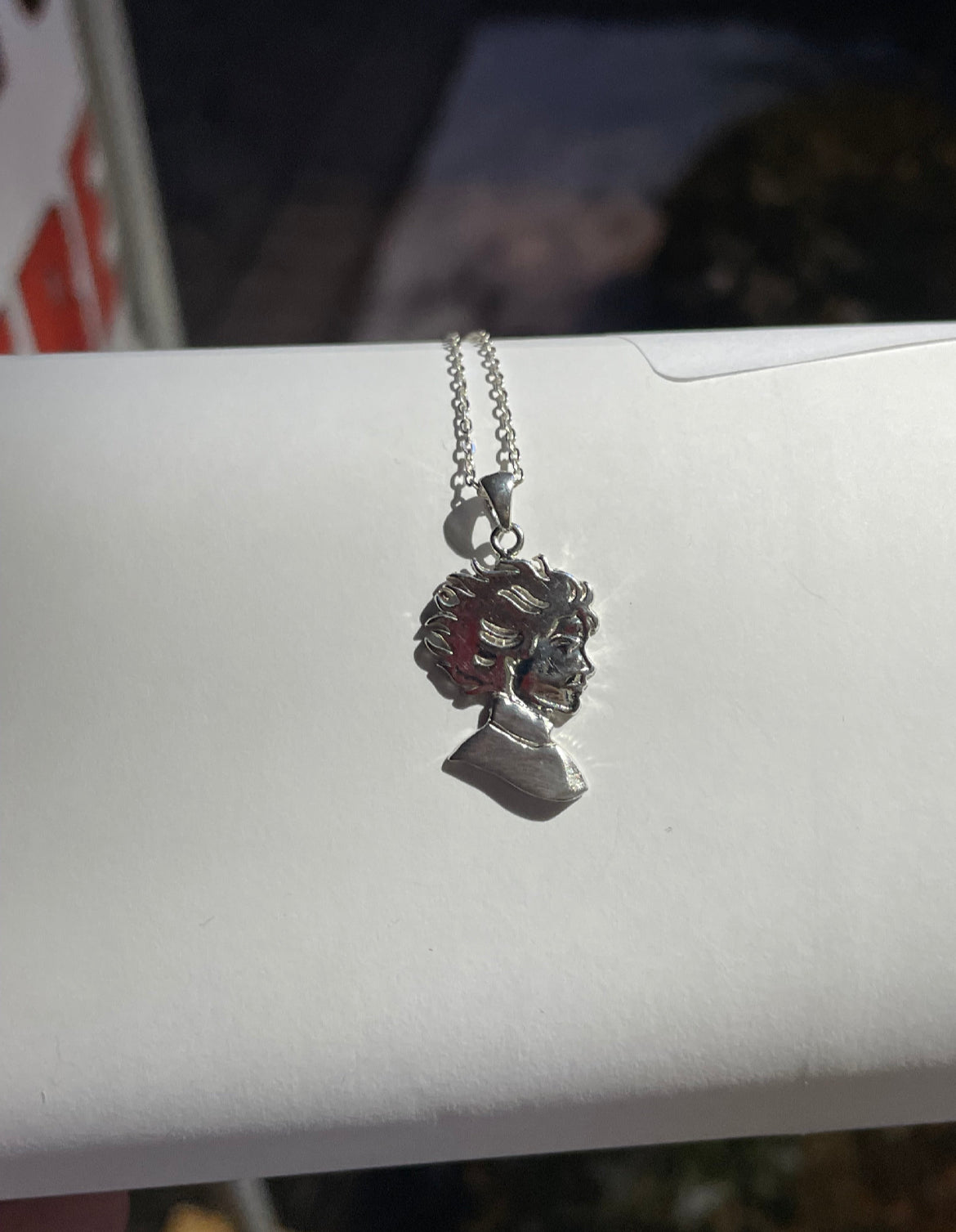 Kristin Kreuk Mad Woman’s Library Logo Necklace