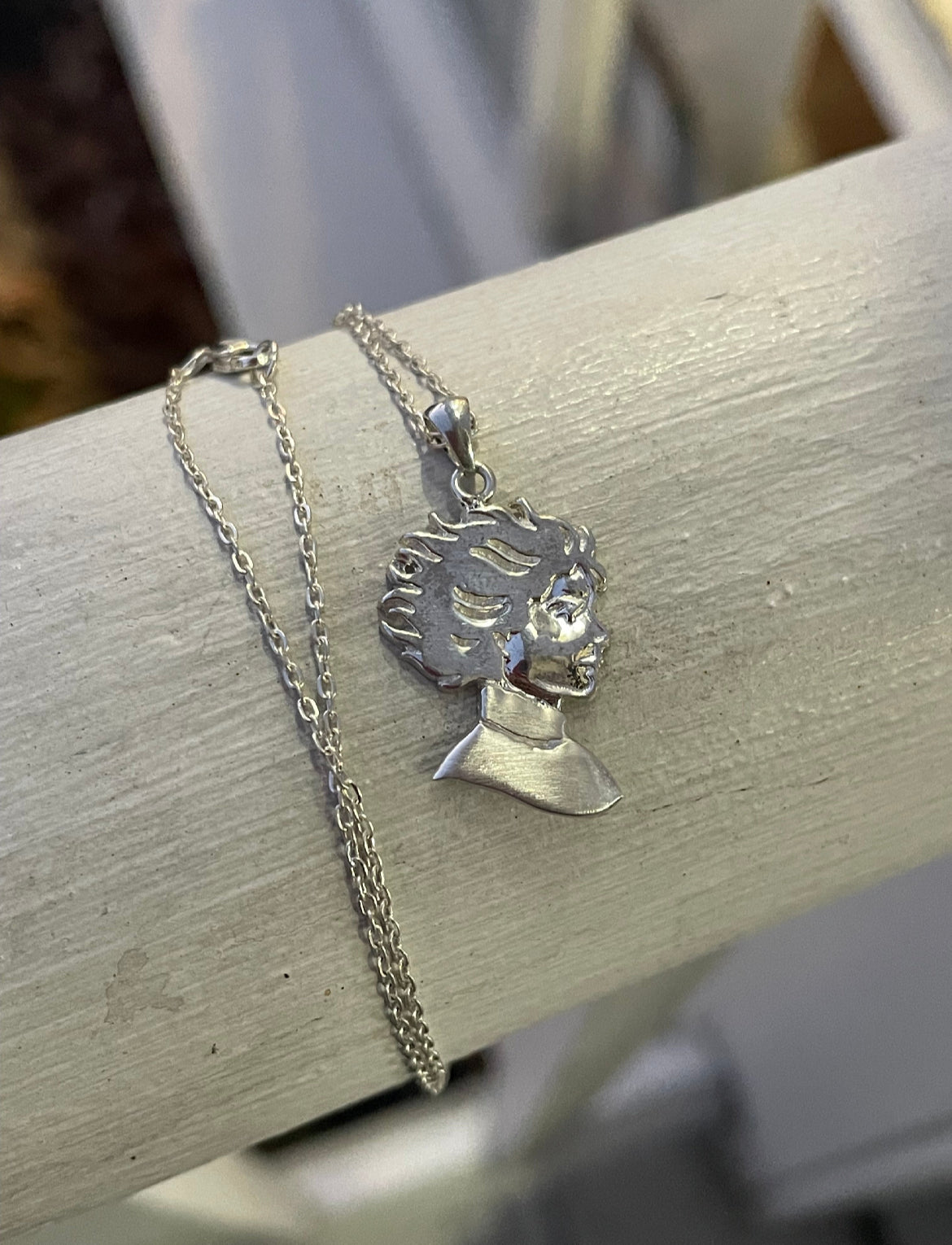 Kristin Kreuk Mad Woman’s Library Logo Necklace