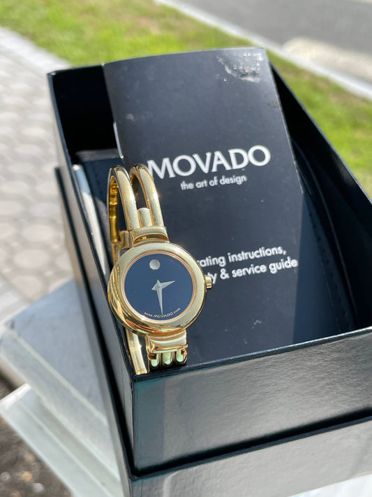 Preowned Ladies Movado Gold tone Harmony Watch 88.A1.809.A 6.5” Wrist w/ Box and Manual