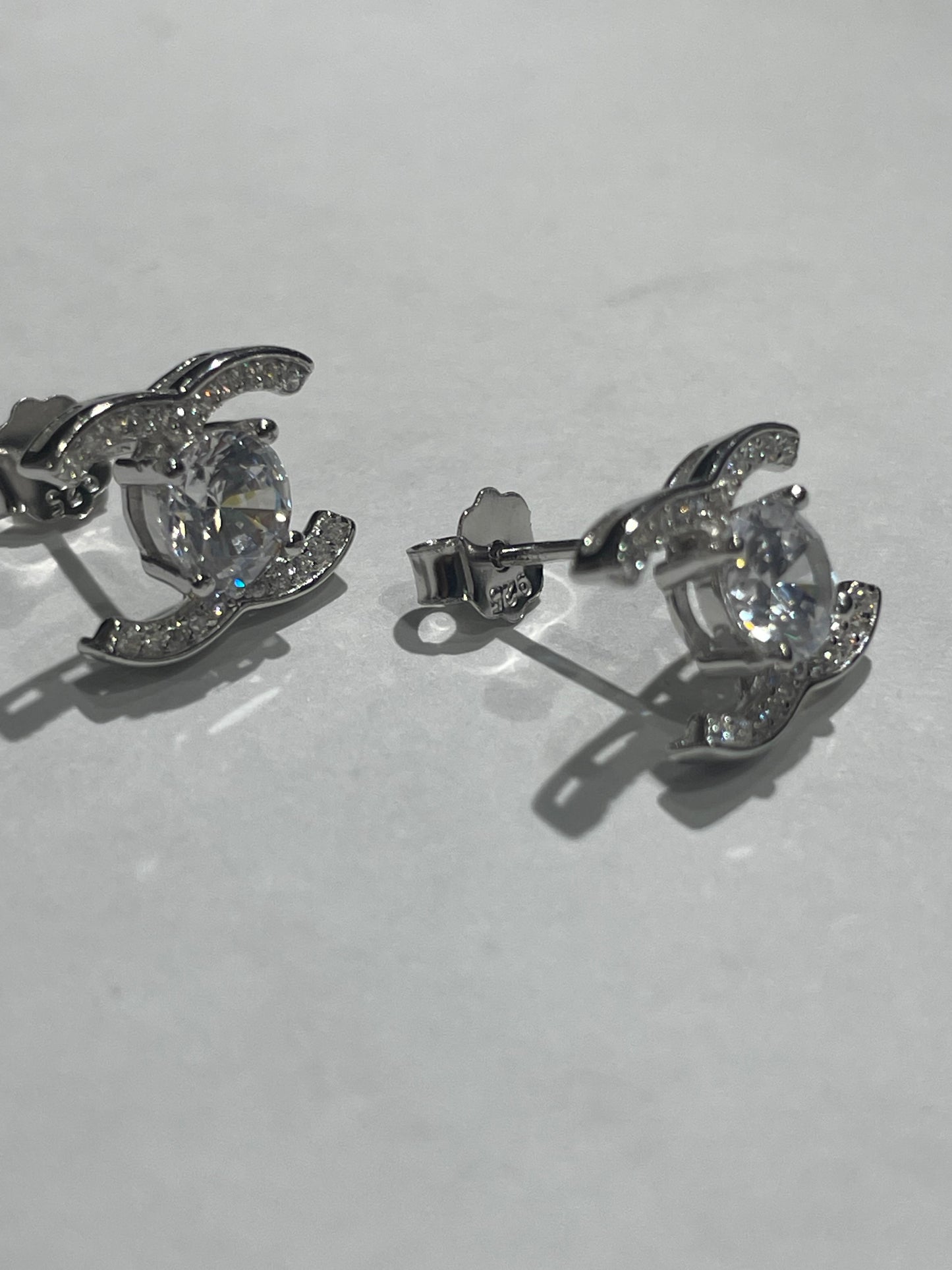 925 Sterling Silver Sparkling Petite Chanel Logo CC Stud Earrings